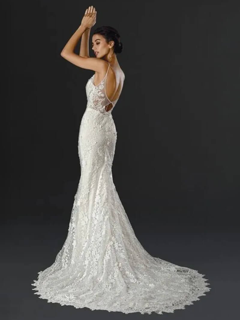 Bride in elegant lace wedding gown.