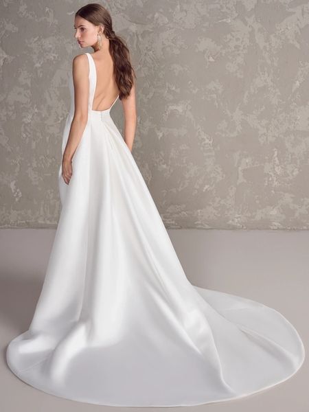 Elegant backless satin wedding gown.