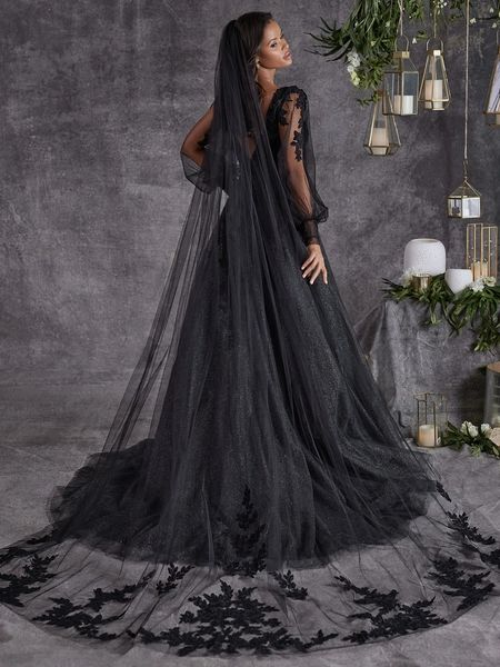 Woman in a black lace wedding gown.
