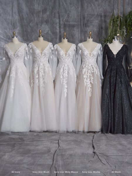 Five wedding dresses in different colors.