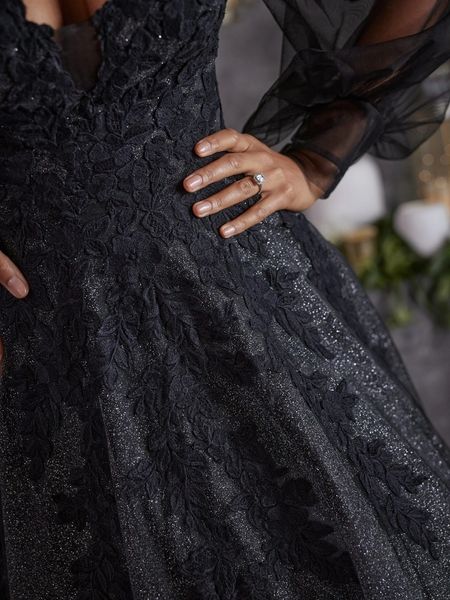 Black lace dress with glitter detail.