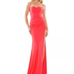 Woman in red fitted evening gown with high slit.
