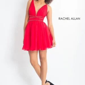 Woman in red dress, smiling and posing.